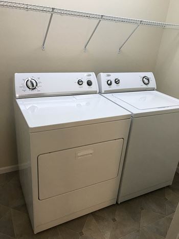 A washer and dryer in the laundry room